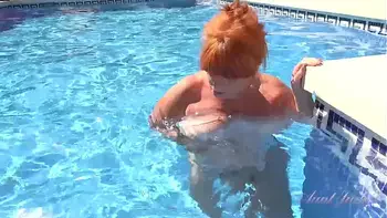 AuntJudys - Busty Mature Redhead Melanie goes for a swim