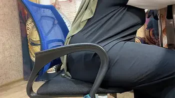 Arab woman in hijab masturbates through her panties while working
