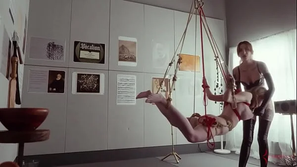 Submissive bondage puppet Rebel Rhyder sucks cock and eats ass in a demented threesome game