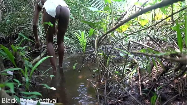 Skinny African tribe woman working outdoor