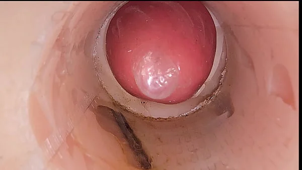 The camera in the deep pussy records a huge ejaculation of sperm into the condom