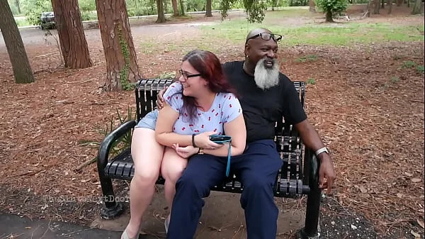 Nerdy Milf strokes and suck blk dick in the Park