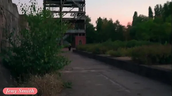 Jeny Smith is walking naked through an abandoned factory.