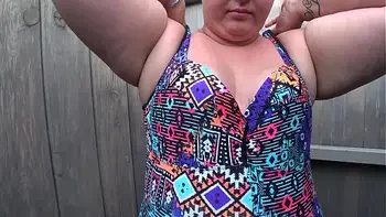 BBW with big booty in tight jeans is dressing in a public dressing room on the beach. Fetish.