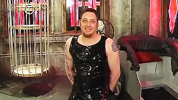 Dominatrix And Slave Boy In Dungeon