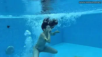 Sexiest petite teen Lizi Vogue swims naked in the pool