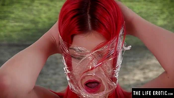 Kinky Redhead Bound In Plastic Wrap Masturbates To An Orgasm