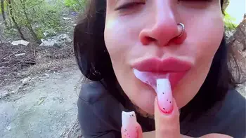 Sucking in public outdoors near people and getting hot sticky cum in her mouth