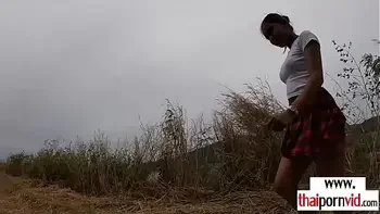 Amateur Thai teen Cherry fucked by a big white cock from behind outdoor