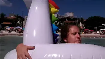 my husband, my unicorn and me in erotic play on a public beach