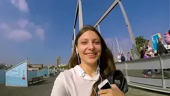 Talia Mint plays in public with remote control toy over the phone with fan