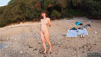 Two lesbian teens have fun on the beach with no clothes