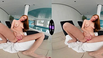 Redhead beauty Holly Molly wanking her pussy in the kitchen