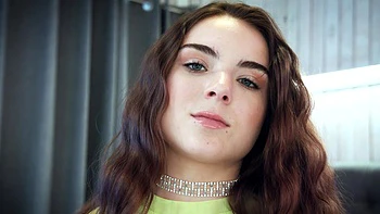 A couple has sex in doggystyle while wearing satin panties, showcasing Megan Marx’s playful energy.