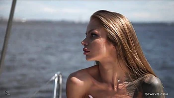Yacht girl with a perfect body is touching her wet shaved pussy