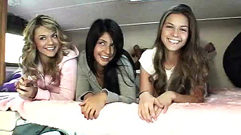 Sexy petite lesbians teasing the camera in close up