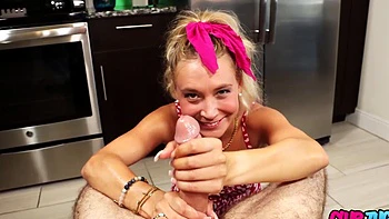 A blonde woman has sex with her boyfriend in the kitchen with a close-up camera