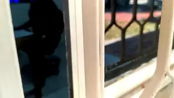 Catching my young neighbor through the window. My neighbor has just turned 18 and I discovered her masturbating while she watches porn on her computer. She watches video of threesomes being half-naked while she touches her pussy.