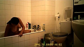 Brunette babe wanks and showers after toilet use