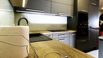 Brunette milf with big tits and ass in short skirt