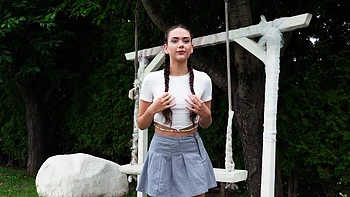 Teen Vixi Rafi sucks cock outdoors with long pigtails