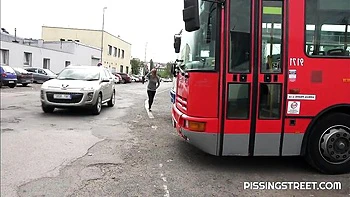 Crazy solo pissing on the pave with a hot short-haired girlfriend Suzie